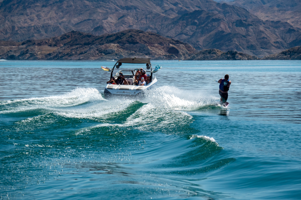 Riding the wake – one of the thrilling watersports to try on Smith Lake.
